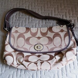 Coach brown, cream and lavender colored shoulder bag.